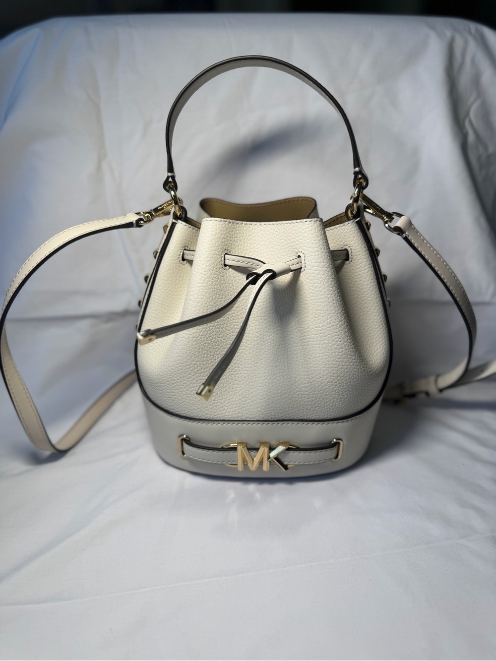 Michael Kors Cream Leather Mini Drawstring Bucket Bag with Gold MK Hardware